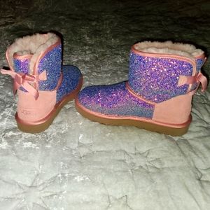 UGG Size 7 short Cosmos blush/peach suede, multi glitter and satin bows.